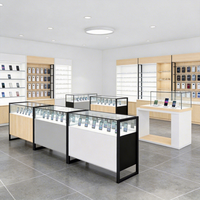 Vitrine de kiosque téléphonique minimaliste moderne pour centre commercial, avec éclairage LED, dos en verre, en aluminium, écologique, personnalisable, pour conception complète de magasin