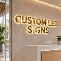 Enseigne en lettres miroir dorées, logo personnalisé Halo Lit en acier inoxydable brossé pour la signalisation murale du hall et de la réception de l'entreprise