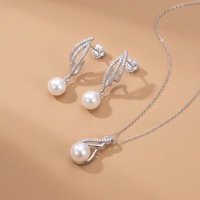 Pendentif et boucles d'oreilles en forme de nœud infini en perles d'eau douce naturelles authentiques de 10-11 mm, ensemble de 2 pièces en argent massif 925
