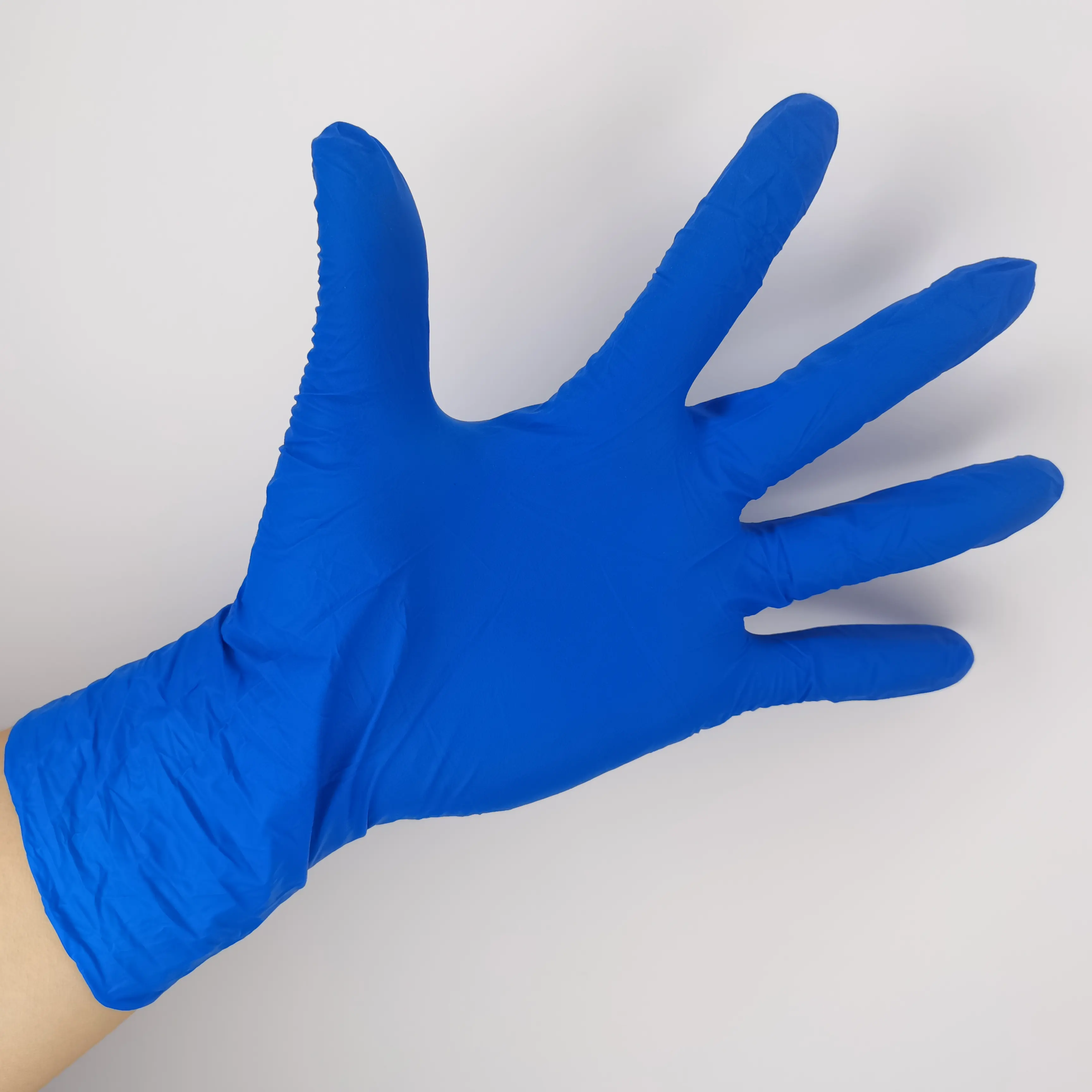 Xingli vente en gros à bas prix bleu sans poudre diverses couleurs sont disponibles gants en nitrile pour le travail