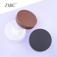 Boîtier à poudre rond avec 3 compartiments, fond transparent givré, couvercle brun peint par pulvérisation, vide pour 3 teintes de poudre libre fixatrice