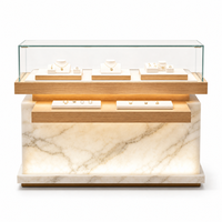 Comptoir de présentation de bijoux personnalisé en bois et marbre avec vitrine en verre éclairée pour magasin de bijoux en gros