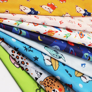 Tela de poliéster Hua Ge Anti Nylon Slant de 125 g/m² con estampado de dibujos animados para ropa infantil. - Product Image 1