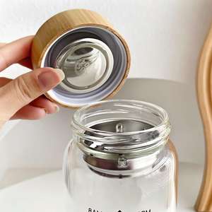 Tasse en verre à thé aux fleurs en borosilicate haute résistance à la température, avec couvercle en bambou et compartiment à thé, design créatif - Product Image 2