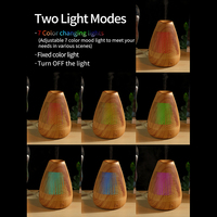 Diffuseur d'arôme d'humidificateur d'huile essentielle ultrasonique d'aromathérapie de grain de bois d'USB de 100ml avec la lumière colorée