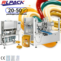 Machine rotative Doypack pour l'emballage automatique de pâte de curry et de liquides alimentaires, avec pompe et moteur faciles à utiliser pour la scellure et l'emballage de sachets.