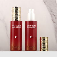 OEM personnalisé 30ml fond de teint plat rouge bouteille pompe en verre forme de cylindre vide pour emballage de crème de soin de la peau modèle 30g