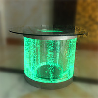 Table basse à bulles d'eau sensorielle en acrylique et acier inoxydable avec lumière LED