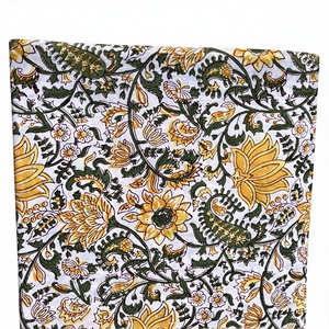Hermosa tela blanca con un intrincado y denso patrón floral con flores amarillas, hojas verdes y enredaderas que crean un diseño rico. - Product Image 1
