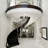 Escalier incurvé moderne personnalisé Escalier intérieur en colimaçon en acier design avec double limon et garde-corps en verre