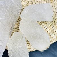 Vente en gros Quartz naturel brut de Nirvana Bouddha Guérison Cristal brut Forme de tour Pierre Top Cristal pour la décoration de cadeaux