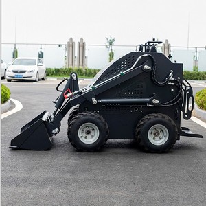 Minicargadora compacta con ruedas, motorizada, de color negro, para uso en construcción y paisajismo. - Product Image 2