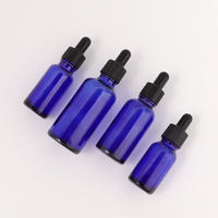 Cosmétiques personnalisés 5 10 15 20 30 50 100ml Petite bouteille en verre transparente bleue avec tête en caoutchouc noir et logo