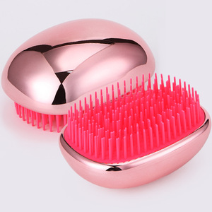 Egg Shaped Massage Comb Rose Gold <b>Silicone</b> Bristles Compact Hair Styling <b>Tool</b> - Product Image 1