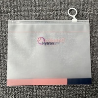 Pochette de voyage cosmétique réutilisable personnalisée en CPE dépoli avec fermeture éclair et anse à anneau, finition mate, pour échantillons de shampoing et mascara