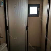 Mini-cabine préfabriquée de luxe standard de 20 pieds, écologique, entièrement installée, avec double aile pliante, appartement intégré et décoration métallique sculptée