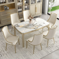 Table à manger en bois massif de luxe chinois moderne avec plateau en marbre et chaises dorées champagne, ensemble complet de la marque Han Yuan