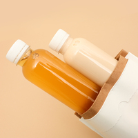 En stock 150ml 200ml 250ml 300ml 350ml 400ml 450ml 500ml Bouteille ronde en plastique PET de qualité alimentaire pour boisson au jus avec couvercle