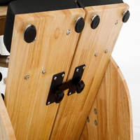 Chaise Wunda de Pilates en bois de chêne pour studio, à résistance divisée, pour la précision et la stabilité du mouvement