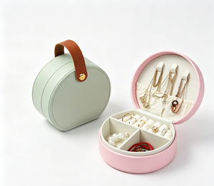 <b>Round</b> portable jewelry <b>box</b> made of premium PU leather with soft velvet lining and precise stitching process - Product Image 4