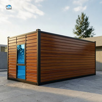 Nouvelle maison conteneur préfabriquée résidentielle de luxe avec panneaux décoratifs extérieurs en bois et portes en verre