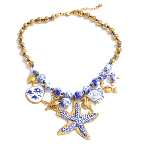 JINYOU 7438 <span class=keywords><strong>Collana</strong></span> Girocollo in Acciaio Inossidabile Placcato Oro a Tema Oceano con Perline in Ceramica Blu e Bianche e Ciondolo a <span class=keywords><strong>Stella</strong></span> <span class=keywords><strong>Marina</strong></span> Smaltata - Product Image 1