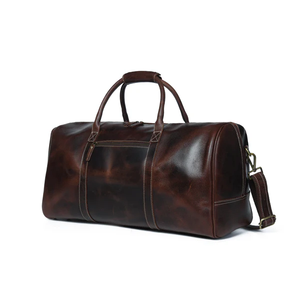 Disfrute de viajes sin esfuerzo con una bolsa de viaje de cuero 100% genuino diseñada para un almacenamiento organizado y un manejo cómodo. - Product Image 2