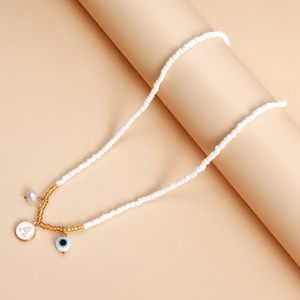 Collar con colgante de ojo de letra de estilo étnico con cuentas de arroz blanco bohemio exclusivo transfronterizo europeo y americano - Product Image 4