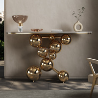 Mesa Consola de Diseño Moderno para el Hogar con Estructura Dorada y Tapa de Mármol en Forma de Elipse