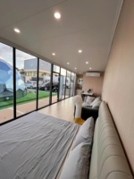 Maison capsule préfabriquée de luxe de 40 pieds avec glissière, cabine modulaire, pod de couchage, villa