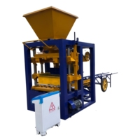 Machine professionnelle de fabrication de briques en ciment QTJ4-24 pour la production de blocs creux, de pavés, de briques pleines et de bordures.