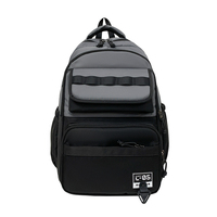 Sac à dos bicolore noir et blanc avec porte-clés dessin animé et logo « C-05 » : Idéal pour le campus, les trajets quotidiens et le streetwear