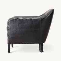 Chaise club en cuir de smoking français des années 1950 inspirée de la campagne de conception Sassanid et de l'ameublement Safari