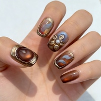 10 faux ongles à presser en amande brun ambre effet œil de chat, avec décorations 3D nœud perlé doré, réutilisables