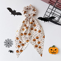 Nouveau serre-tête Halloween avec un imprimé fantaisie citrouille en satin pour filles, doté d'un grand nœud à l'arrière de la queue de cheval.