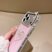 Coque de luxe antichoc avec oreilles de chat, strass, perles et cœur pour iPhone 17 16 15 Pro Max, protection 3D avec nœud et diamants scintillants