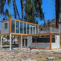 Conteneur ondulé bleu marine Apple Cabin House à deux niveaux avec toit incliné, auvent et fenêtre, idéal pour les comptoirs de magasins de centres commerciaux