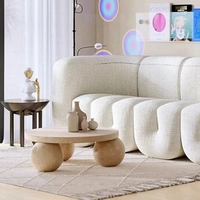 Table basse italienne minimaliste de luxe léger avec base sphérique, design circulaire moderne et créatif