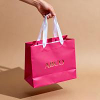 Sacs fourre-tout de grande capacité, sacs en papier recyclables respectueux de l'environnement avec logo de couleur personnalisé et personnalisé pour vêtements de centre commercial