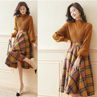 Ensemble deux-pièces en tricot côtelé à manches longues, avec jupe à carreaux en diamant, style européen hivernal et mode.