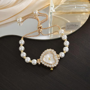 Montre élégante et tendance de style scolaire ovale de luxe pour étudiants unisexes, avec un cœur serti de diamants, une boucle à tirette en perle - Product Image 4