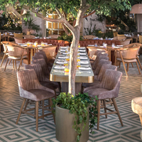 Ensemble de mobilier commercial JEILI pour restaurant : banquette en cuir marron, table ronde et chaises en rotin pour projets hôteliers et d'accueil.