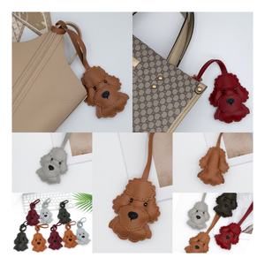Goreal 2025 nueva llegada bolso de mujer encantos oso de peluche perro juguete caniche cuero muñeca bolso decoración Metal llaveros - Product Image 1
