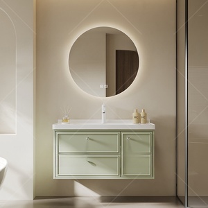 Meuble de salle de bain vert simplifié avec miroir en verre alvéolé, vasque blanche et corps de meuble suspendu - Product Image 1
