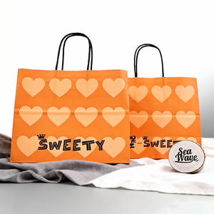 Bolsas de Compras de Papel Kraft <span class=keywords><strong>Naranja</strong></span> con Estampados de Corazones y Asas Retorcidas para Regalos de <span class=keywords><strong>Fiesta</strong></span> - Product Image 1