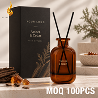 Diffuseur d'arômes personnalisé LF en verre ambré, parfum cèdre, avec bâtonnets noirs et bordure dorée, coffret cadeau foncé, étiquette personnalisée
