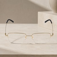 Gafas de titanio IP con logotipo personalizado al por mayor, monturas ópticas modernas minimalistas de medio aro, brillantes, doradas, de moda.