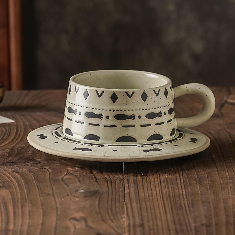 Small fish-shaped earthenware cups and saucers