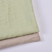 Tissu pour vêtements féminins en rayonne viscose mat haute densité, ondulé, jacquard tricoté, respirant, printemps-été, de marque tendance et de haute qualité