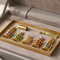 Nouveau flacon de parfum de luxe 10 ml, cylindrique, motif treillis doré, avec applicateur à bille, rechargeable, flacon cadeau avec bouchon à vis offert